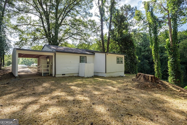 exterior space featuring a carport