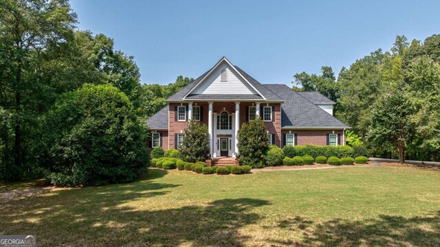 view of front of home with a front yard