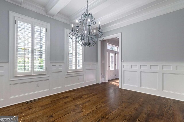 unfurnished dining area with a wealth of natural light, a chandelier, beamed ceiling, and dark wood-type flooring