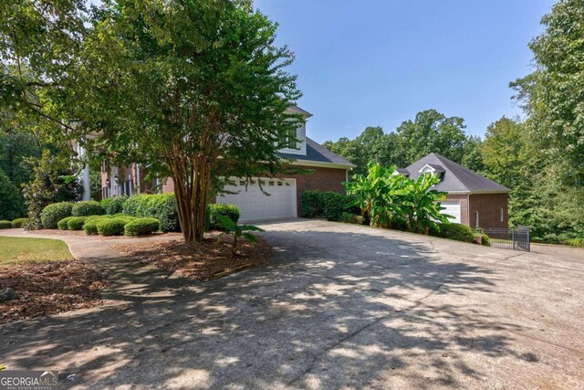 obstructed view of property with a garage