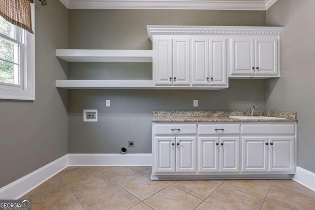 laundry area featuring washer hookup, ornamental molding, sink, cabinets, and electric dryer hookup