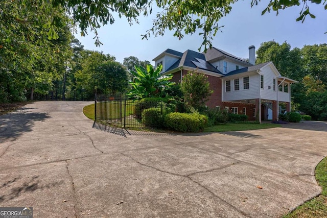 view of side of home with a yard