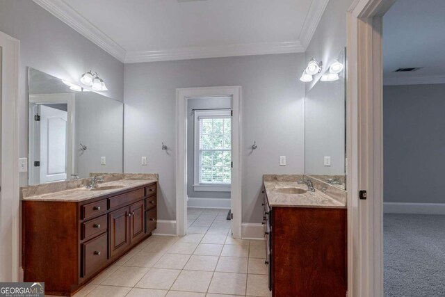 bathroom with ornamental molding, tile patterned floors, and vanity