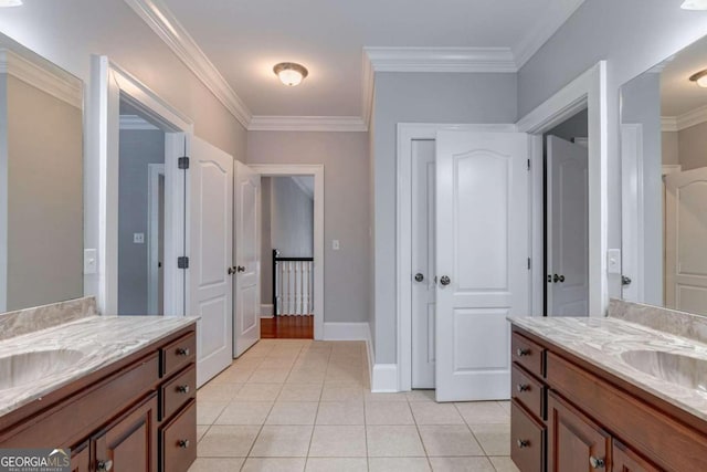 bathroom featuring ornamental molding, tile patterned flooring, and vanity