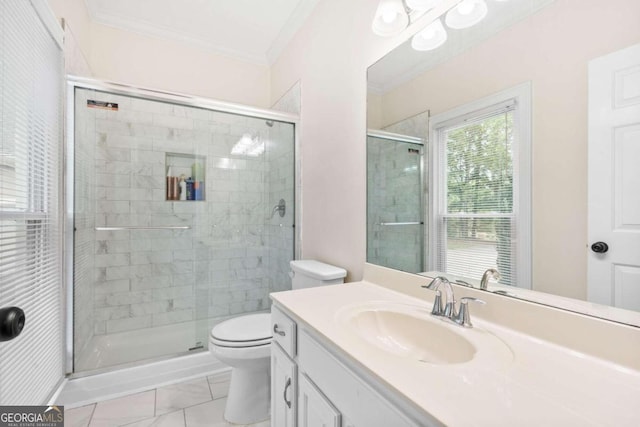 bathroom with vanity, crown molding, toilet, and walk in shower