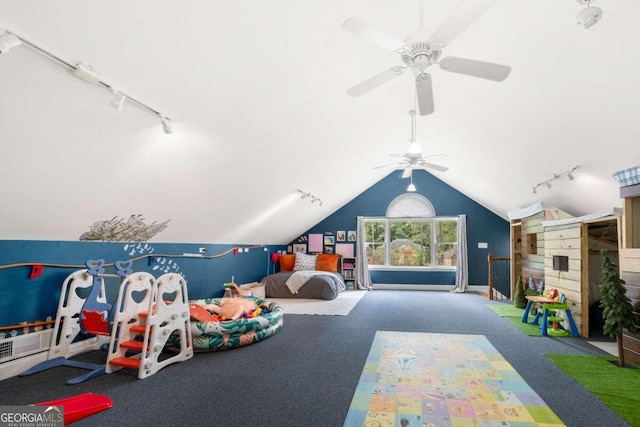 rec room with lofted ceiling, carpet, rail lighting, and ceiling fan