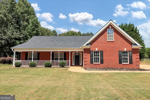 80 Stewart Hollow Ln, Covington, GA 30016 - view of front facade with a front yard, covered porch, and brick siding
