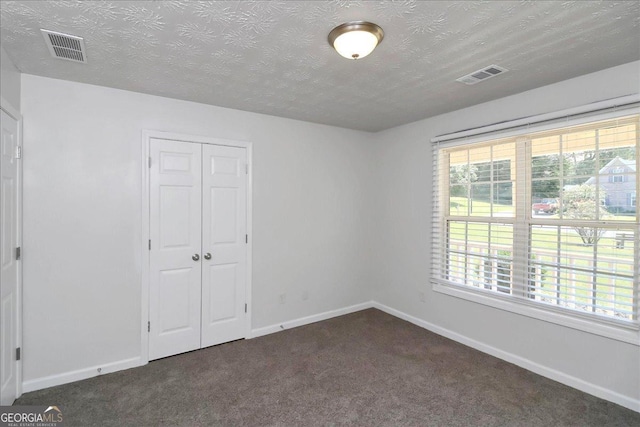 80 Stewart Hollow Ln, Covington, GA 30016 - unfurnished room with baseboards, visible vents, and dark colored carpet