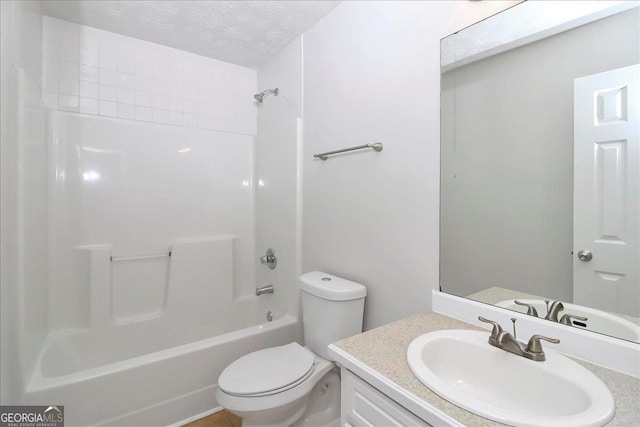 80 Stewart Hollow Ln, Covington, GA 30016 - full bathroom featuring a textured ceiling, toilet, tub / shower combination, and vanity