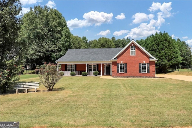 80 Stewart Hollow Ln, Covington, GA 30016 - view of front of house with covered porch, brick siding, and a front lawn