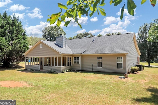 80 Stewart Hollow Ln, Covington, GA 30016 - rear view of house with a lawn, a sunroom, a chimney, and cooling unit