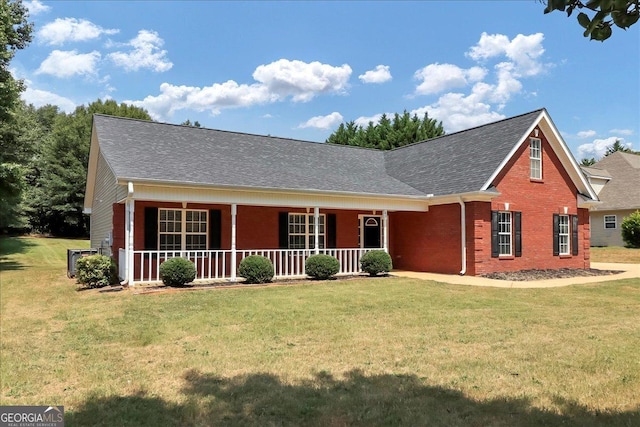 80 Stewart Hollow Ln, Covington, GA 30016 - view of front of property featuring brick siding, a shingled roof, a front lawn, and covered porch