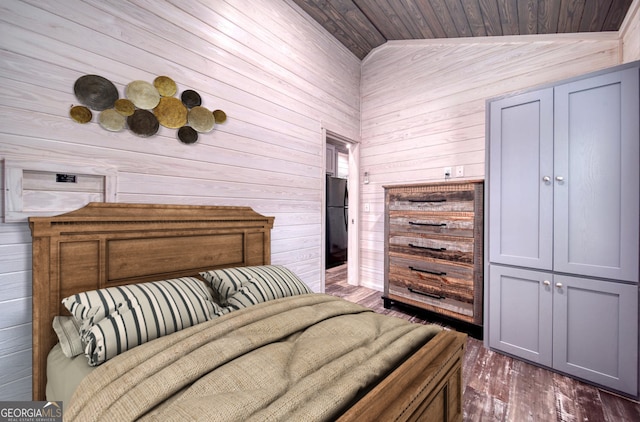 bedroom featuring lofted ceiling, wood walls, wooden ceiling, and dark hardwood / wood-style flooring