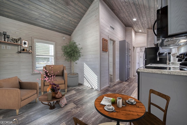 dining room featuring wood ceiling, dark hardwood / wood-style floors, wood walls, and high vaulted ceiling