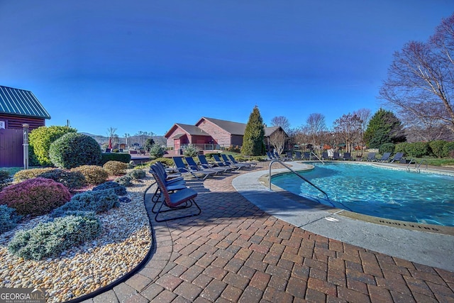 view of pool featuring a patio