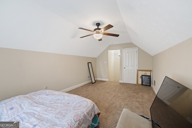 carpeted bedroom featuring lofted ceiling and ceiling fan