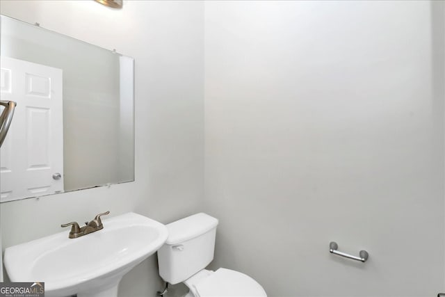 bathroom with sink and toilet