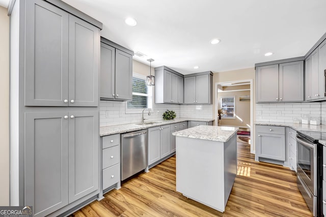 179 Bamboo Pt, Hartwell, GA 30643 - kitchen with appliances with stainless steel finishes, gray cabinetry, light wood-style flooring, and recessed lighting