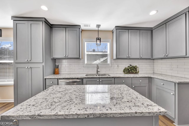 179 Bamboo Pt, Hartwell, GA 30643 - kitchen featuring gray cabinetry, light wood finished floors, stainless steel dishwasher, and recessed lighting