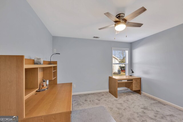 carpeted office with ceiling fan