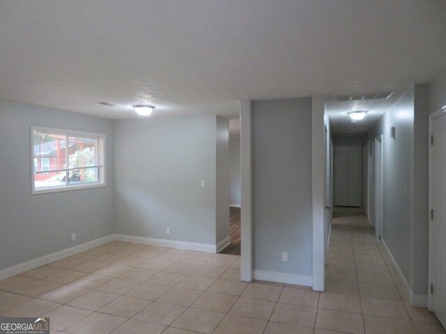 view of tiled spare room