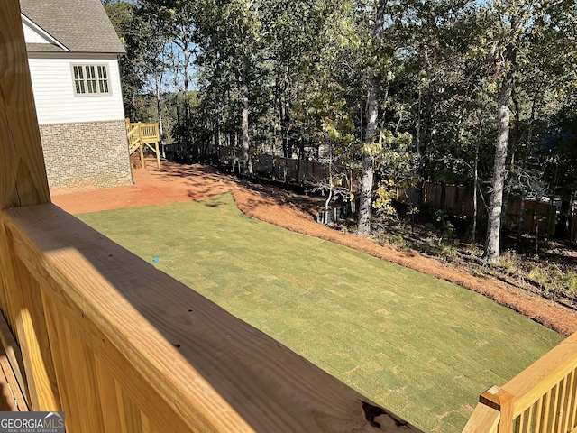 view of yard featuring a wooden deck