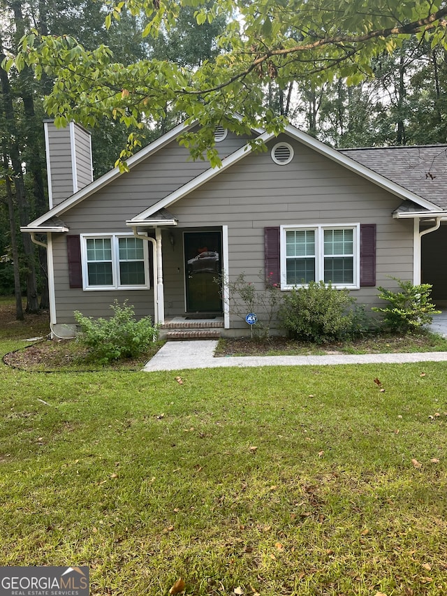 view of front of house with a front lawn