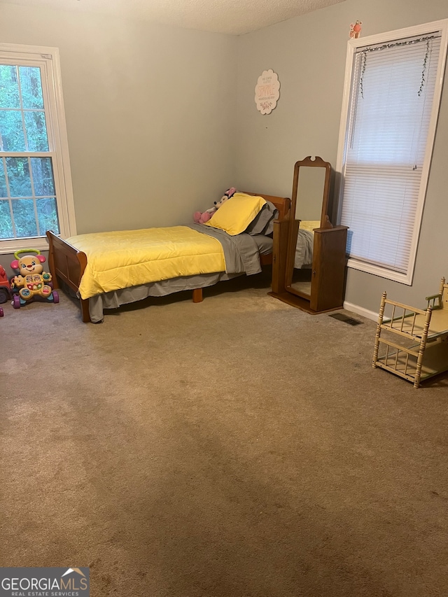 unfurnished bedroom with carpet flooring