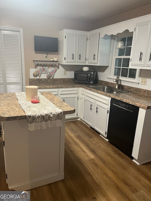 kitchen featuring black dishwasher, dark hardwood / wood-style floors, tasteful backsplash, and white cabinets