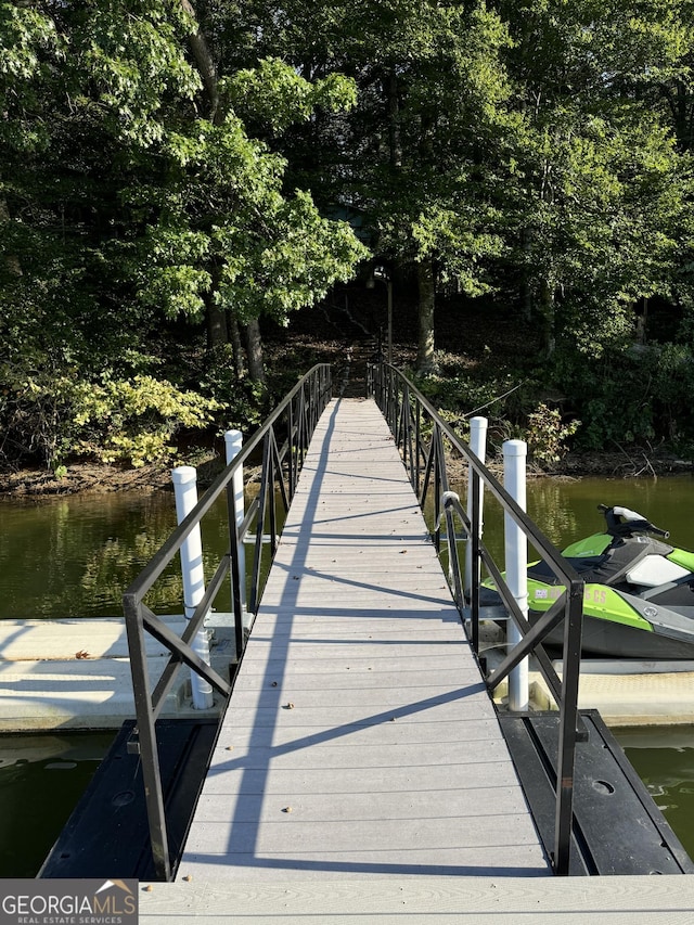 view of dock with a water view