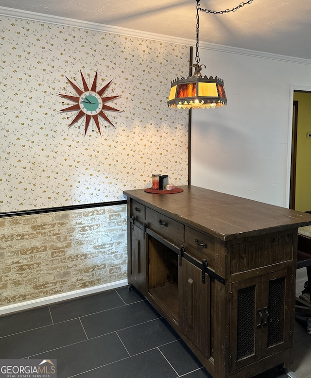 interior space featuring ornamental molding and dark tile patterned floors