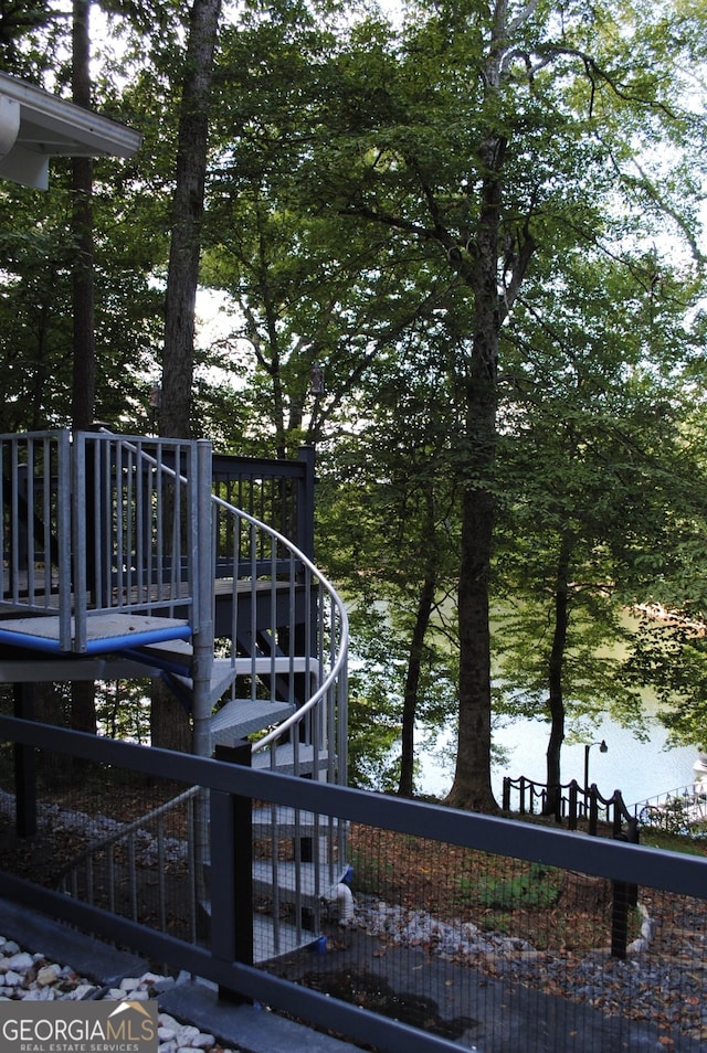 wooden deck featuring a water view