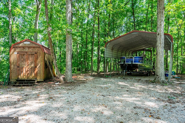 exterior space with a storage shed and a carport