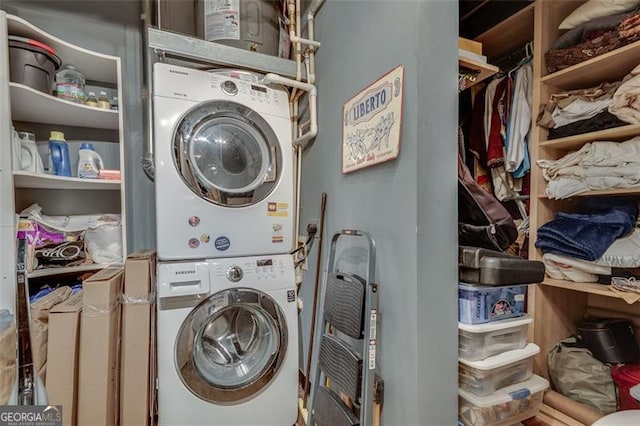 laundry room featuring stacked washer and dryer