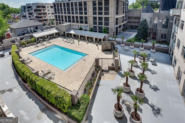 view of swimming pool with a patio