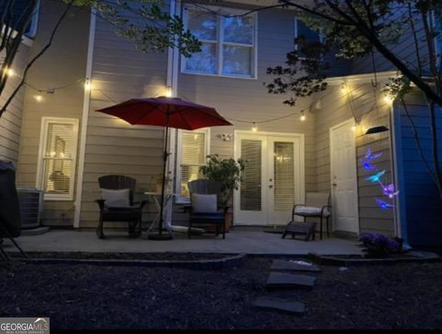 back of house with a patio area and french doors