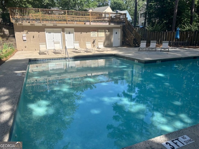 view of swimming pool with a patio area