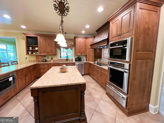 kitchen with pendant lighting, dishwasher, custom exhaust hood, sink, and crown molding