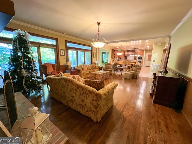 living room featuring hardwood / wood-style floors and ornamental molding