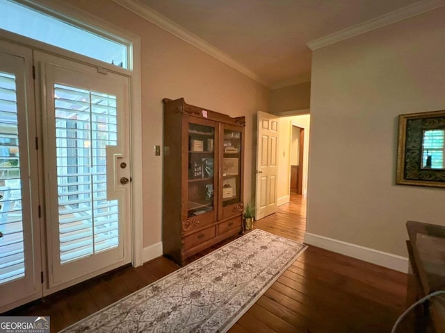 doorway with dark hardwood / wood-style flooring and ornamental molding