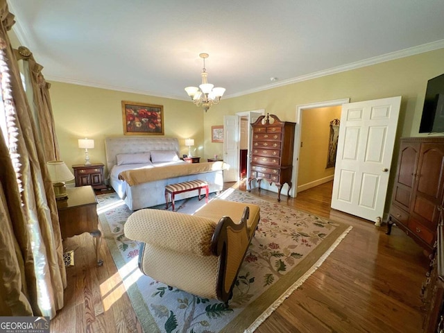 bedroom with a chandelier, dark hardwood / wood-style flooring, and crown molding