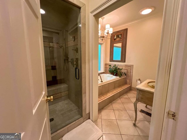 bathroom with crown molding, tile patterned flooring, independent shower and bath, and an inviting chandelier