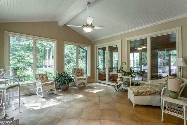 sunroom / solarium with lofted ceiling with beams and ceiling fan