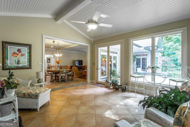 sunroom / solarium featuring vaulted ceiling with beams and ceiling fan