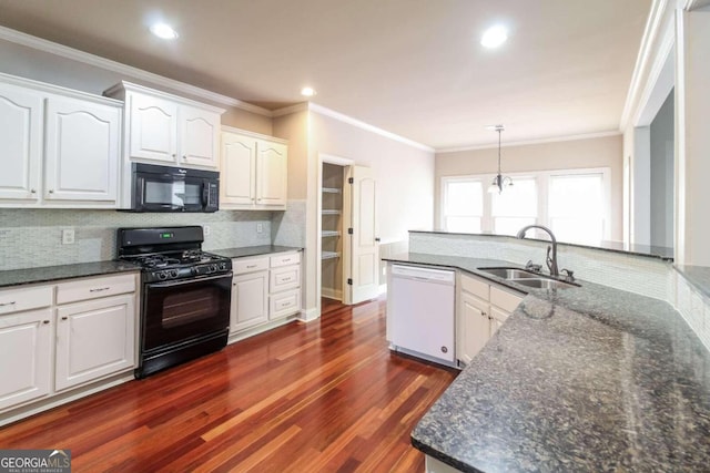 kitchen featuring white cabinets, black appliances, and sink