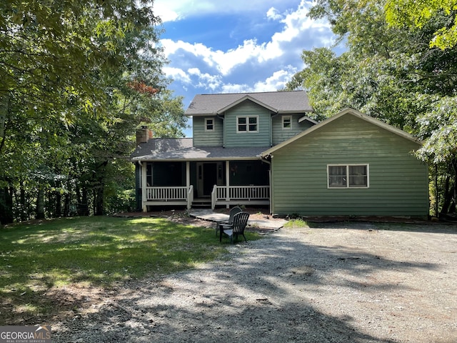 back of house featuring a yard