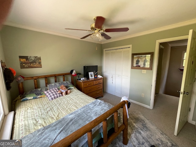 bedroom featuring ornamental molding, a closet, ceiling fan, and carpet floors