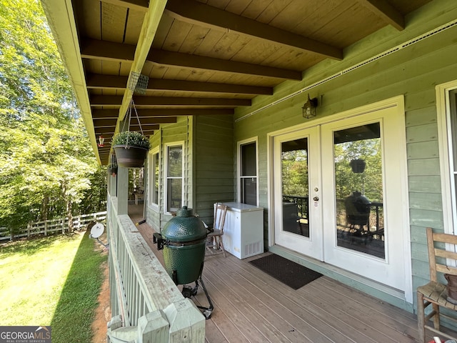 wooden deck featuring french doors