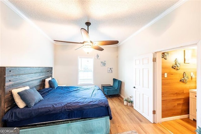 bedroom with light wood-type flooring, ceiling fan, wooden walls, and a textured ceiling