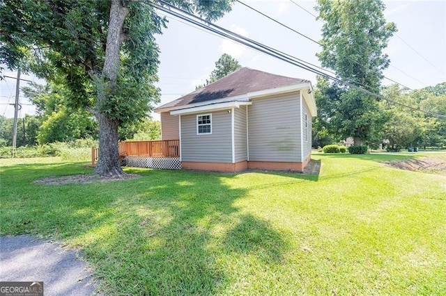 view of yard with a wooden deck